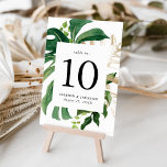 Modern Tropical Leaves Gold Personalized Table Number<br><div class="desc">Elegant tropical table number cards featuring the table number and your wedding details framed by a border of watercolor tropical leaves in shades of green complimented by gold foliage. Personalize by adding your names and wedding date. The design repeats on the back of the card. Designed to coordinate with our...</div>