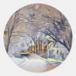Modern watercolor of colored snowed trees classic round sticker