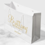 Modern White and Gold Personalized Bridesmaids Large Gift Bag<br><div class="desc">Modern White and Gold Personalized Bridesmaids Gifts featuring personalized bridesmaid's name in gold modern script font style with title and wedding date in gold modern sans serif font style. Also perfect for Maid of Honor, Flower Girl, Mother of the Bride and more. Please Note: The foil details are simulated in...</div>
