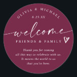 Modern Wine Burgundy Wedding Welcome Hotel Bag Classic Round Sticker<br><div class="desc">Wine Hotel Bag Stickers: Rich and stylish, these wine-colored modern handwriting wedding welcome stickers bring a sophisticated touch to your wedding weekend. Each 3-inch round sticker displays “welcome friends & family” with a heart accent and space for your personal message, names, and date. The deep wine hue and flowing handwritten...</div>