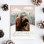Modern Winter Forest Christmas. Believe Arch Photo Holiday Card<br><div class="desc">Celebrate the magic of the season with this elegant “Believe” Christmas card featuring your photo framed in a arch window, surrounded by a snowy forest and delicate winter trees. A dreamy sky with falling snow and clouds adds a cozy touch to this warm, romantic holiday design. Perfect for couples or...</div>