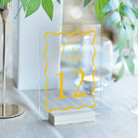 Modern Yellow Wavy Frame Acrylic Table Numbers<br><div class="desc">Elevate your wedding decor with these Modern Wavy Frame Acrylic Wedding Table Numbers! Featuring a unique retro design, each table card showcases “Table” in a stylish handwritten yellow script with the table number below. A chic yellow wavy border surrounds the number, creating a striking contrast against your choice of a...</div>