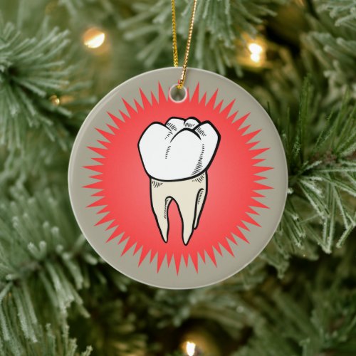 Molar freshly extracted on a red starburst ceramic ornament