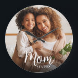 Mom Established Date White Script Custom Photo Large Clock<br><div class="desc">Being a mom is one of the most important jobs in the world. Give your favorite mom a reminder of how much she’s loved with this bold, modern custom photo wall clock. Simple white script calligraphy and sans serif typography overlay your custom photo. Personalize with the photo of your choice...</div>