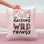 Mom Raising Wild Things Quote Funny Leopard Print Throw Pillow<br><div class="desc">This cute and funny design is perfect for any mom on Mother's Day, for her birthday, or all year round. It features the quote, "Mom. Raising Wild Things, " with a hand-drawn heart arrow, and leopard cheetah print typography in blush pink and black. It's modern, sweet, girly, and cool; the...</div>