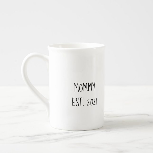 Mommy 'est year' mug for new parents (Left)