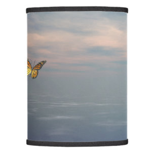 monarch butterfly flying upon the ocean lamp shade