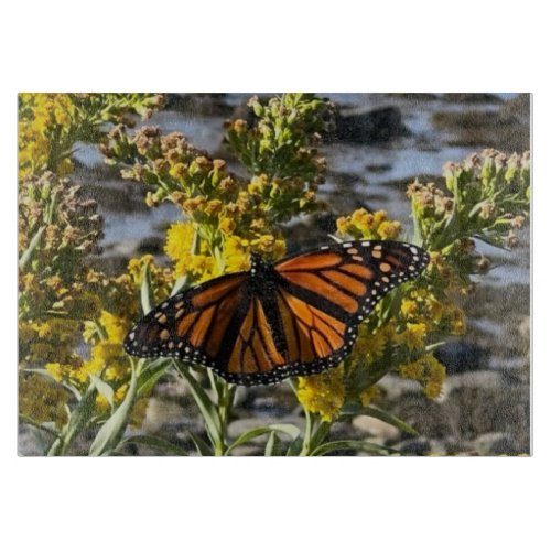 Monarch Butterfly on a Flower by the Water Nature Cutting Board