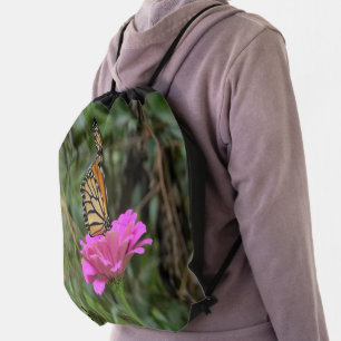 Monarch Butterfly on a Pretty Pink Zinnia Flower Drawstring Bag