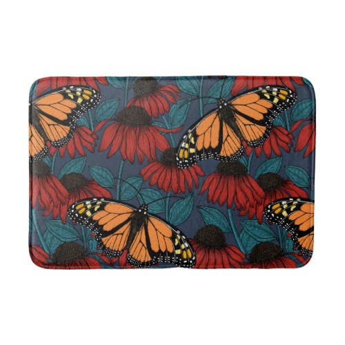 Monarch butterfly on red coneflowers bath mat