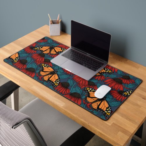 Monarch butterfly on red coneflowers desk mat