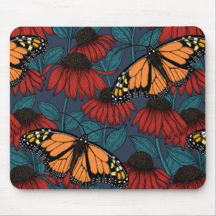Monarch butterfly on red coneflowers mouse pad