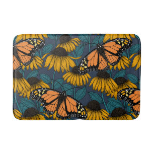 Monarch butterfly on yellow coneflowers bath mat
