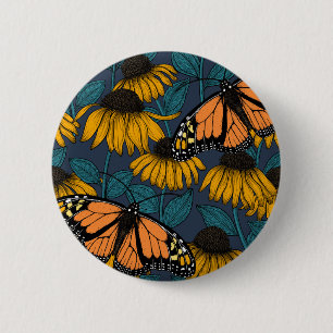 Monarch butterfly on yellow coneflowers button