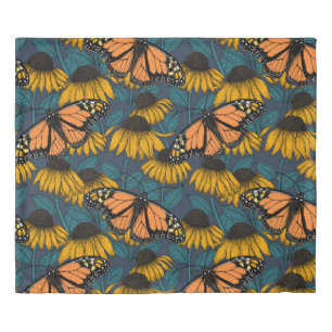 Monarch butterfly on yellow coneflowers duvet cover