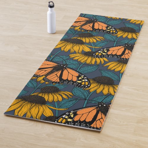 Monarch butterfly on yellow coneflowers yoga mat