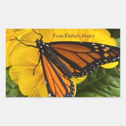 Monarch butterfly on yellow primroses rectangular sticker