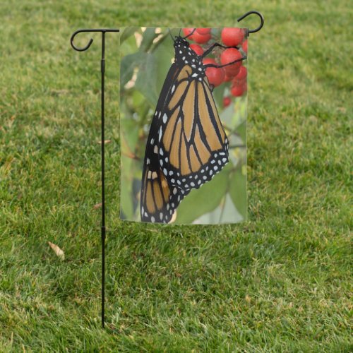 Monarch butterfly with red berries garden flag