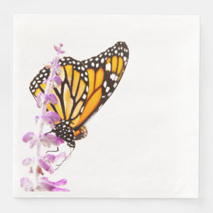 Monarch perched on lavender paper dinner napkins