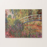 MONET Water Lily Pond 10x14 Puzzle WATER IRISES<br><div class="desc">Magnificent view of the backyard water garden personally designed by French Impressionist painter, Claude Monet, is portrayed in his 1900 painting, Water Lily Pond: Water Irises. Pond lilies and a picturesque Japanese footbridge complete the scene. Luscious rose tones accented by soft blues and greens suggest mid summer. The original art...</div>