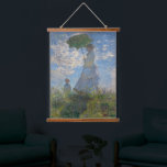 Monet's Woman with Parasol,Impressionist Landscape Hanging Tapestry<br><div class="desc">Claude Monet's Woman with a Parasol was painted in 1875 and is one of his iconic impressionist masterpieces. The painting depicts Madame Monet and her son, captured in a windy outdoor setting. The woman is holding a parasol, and the child stands beside her. The scene is set against a vibrant...</div>
