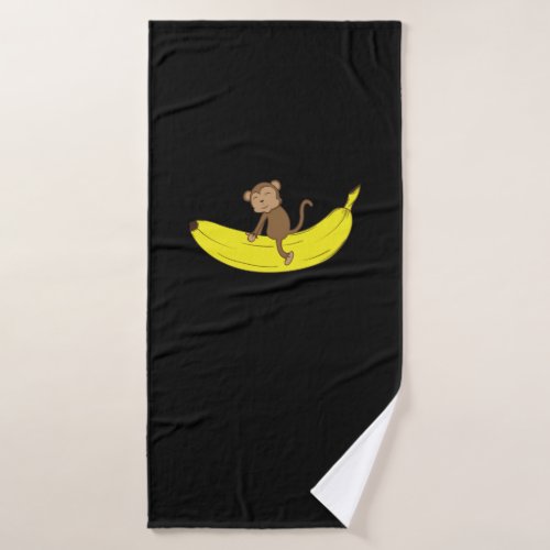 Monkey rides on bananas bath towel