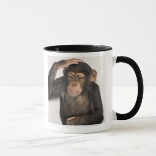 Monkey scratching its head mug