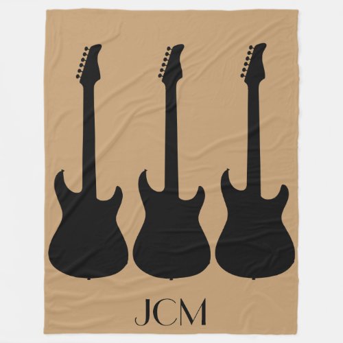 Monogram Black Electric Guitars on Camel Brown Fleece Blanket