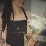 Monogram Black Gold | Modern Minimalist Elegant Apron<br><div class="desc">A simple stylish custom monogram design in a gold modern minimalist typography on an off black background. The monogram initials and name can easily be personalized along with the feature line to make a design as unique as you are! The perfect bespoke gift or accessory for any occasion.</div>