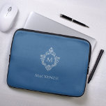 Monogram Classic Blue Vintage Elegant Crest Name Laptop Sleeve<br><div class="desc">A classic blue and silver design with the monogram initial in a vintage crest, recommended for a man. The crest is faux silver foil, the background is classic blue. Under the crest there is the name in gray caps. The vintage floral crest from an old book cover binding, of the...</div>