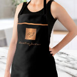 Monogram elegant black gold name script  apron<br><div class="desc">Luxury exclusive looking monogrammed stylish apron featuring a faux gold copper metallic glitter square and lines over a stylish classy solid black background.           Personalize it with your name or family name and monogram name initial.</div>