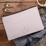 Monogram Elegant Minimal Blush Pink and Gold Accessory Pouch<br><div class="desc">A simple stylish custom monogram design in a gold modern minimalist typography on an elegant pastel blush pink background. The monogram initials and name can easily be personalized along with the feature line to make a design as unique as you are! The perfect bespoke gift or accessory for any occasion....</div>