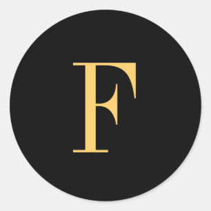 Monogram F gold-colored on black background Classic Round Sticker