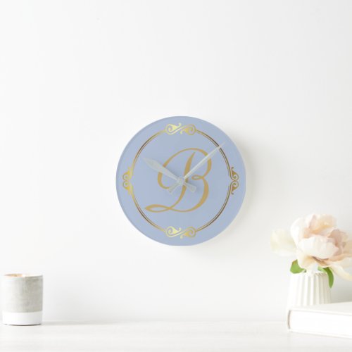 Monogram in gold with infinity circle on Blue  Round Clock