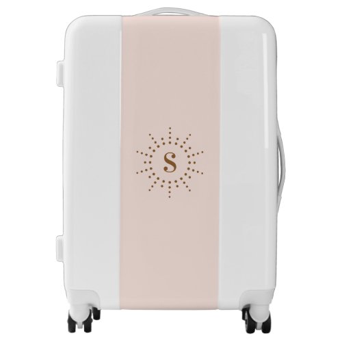 Monogram initial radial sunburst on light pink luggage