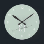 Monogram Initials Names Elegant Script Sage Green Round Clock<br><div class="desc">Newlywed Monogram Initials Names Elegant Script Newlywed Sage Green. Romantic typography with couples' initials and names which you can easily personalise.</div>