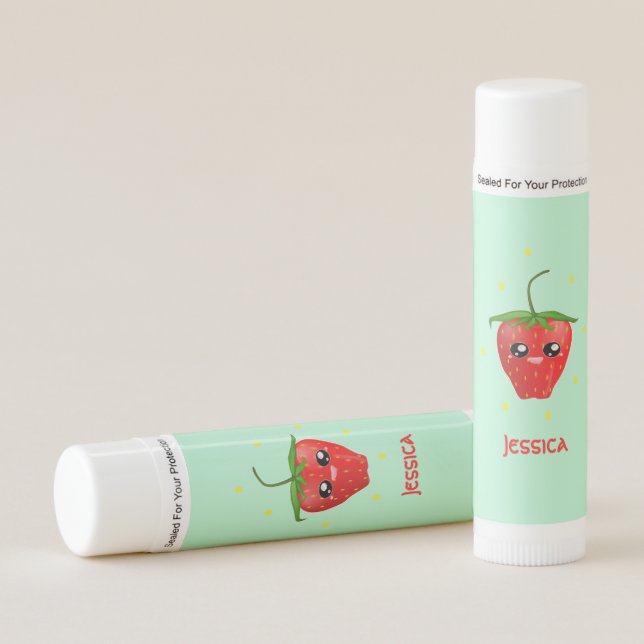 Monogram kawaii strawberry fruit on turquoise lip balm (Front)