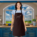 Monogram name black gold apron<br><div class="desc">A stylish black background. Personalize and add your first name and monogram initial.  White and golden text.</div>