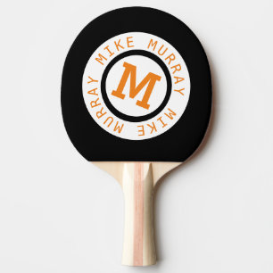 monogram on black Ping-Pong paddle