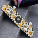 Monogram Retro Groovy Daisy Checkerboard Skateboard<br><div class="desc">Monogram Retro Groovy Daisy Checkerboard Skateboard features a groovy daisy pattern on a black and white checkerboard pattern background with your custom text or personalized initials in the center. Perfect as a gift for family and friends for Christmas,  birthday,  holidays,  work colleagues and more. Created by ©Evco Studio www.zazzle.com/store/evcostudio</div>