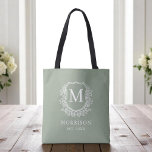 Monogram Sage Green Crest Botanical Wedding  Tote Bag<br><div class="desc">Bring a fresh, elegant touch to your celebration with our Monogram Sage Green Crest Botanical Wedding Tote Bag. Featuring a soft sage green background, a refined botanical crest, and your personalized monogram, this tote perfectly combines timeless charm with modern style. Ideal for wedding welcome bags, bridal party gifts, or guest...</div>