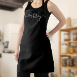 Monogram Script Handwritten Minimal Black Apron<br><div class="desc">Step into a world where each stroke of the pen tells a story – your story. Our custom aprons, adorned with your name inscribed in a modern script handwritten font, are not merely protective wear but a canvas that reflects your unique identity. Experience the elegant blend of contemporary style and...</div>