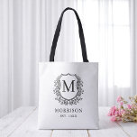 Monogram White Black Crest Botanical Wedding  Tote Bag<br><div class="desc">Make a timeless statement with our Monogram White Black Crest Botanical Wedding Tote Bag. Featuring a clean white background, a sophisticated black botanical crest, and your personalized monogram, this tote offers a perfect blend of classic style and modern design. Ideal for welcome bags, bridal party gifts, or guest favors, it’s...</div>