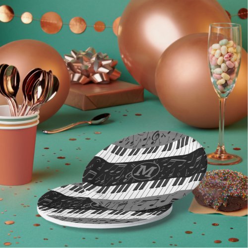 Monogrammed curve piano keys and musical notes paper plates