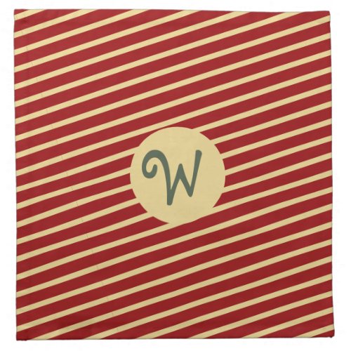 Monogrammed gold stripes pattern on red cloth napkin