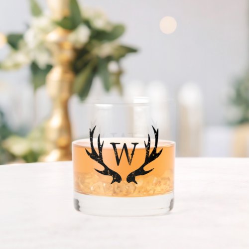 Monogrammed whiskey glass with deer antler logo