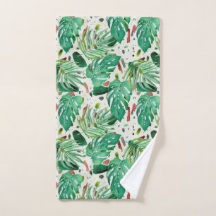 Monstera leaves and palm leaves on terazzo backgro hand towel