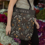 Moody Winter Botanical Personalized Tote Bag<br><div class="desc">Bring holiday charm wherever you go with this all-over print tote bag by Redwood & Vine Design Co. Designed with a moody botanical Christmas pattern of rich greenery, oranges, and festive foliage, this tote blends seasonal elegance with everyday function. Personalize it with a name for a thoughtful Christmas gift, or...</div>