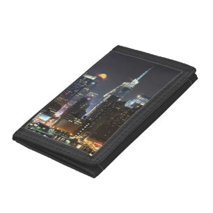 Moon rises over midtown New York. Trifold Wallet