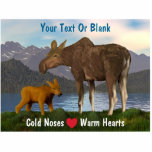 Moose In The Meadow Statuette<br><div class="desc">A common springtime sight in the North.  A mama moose and her cute calf with a lake and mountains in the distance.  The slogan "Cold Noses (A red heart) Warm Hearts" also appears. Add your own additional text.</div>